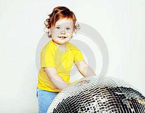 Little cute adorable baby girl holding disco ball isolated on white close up, sweet real toddler