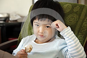 Little cute asian girl eating