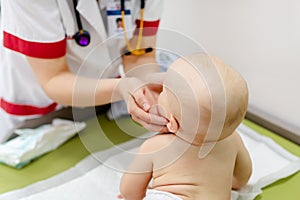 Little cute baby boy visiting doctor . Pediatrician make check up and examining infant for disease prevention protocol