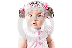 Little cute baby-girl in pink dress isolated on white background