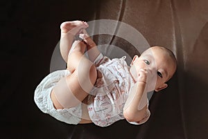 The little cute baby infant boy sucking thumb  hand