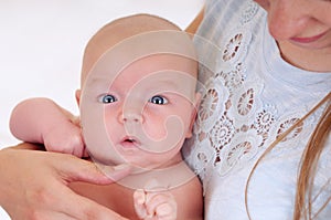 Little cute baby on mother`s hand