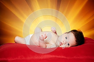 Little cute baby with sunshine background