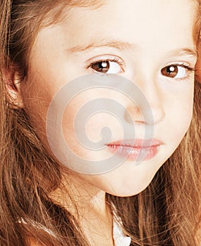 little cute beauty girl isolated on white background holding flower lily in her hair, close up adorable kid