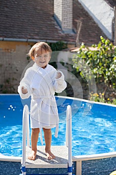 Little cute boy in a big swimming pool