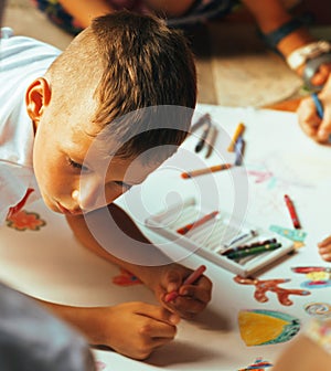 Little cute boy with company painting on birthday party