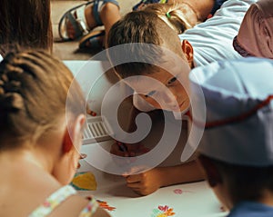 Little cute boy with company painting on birthday