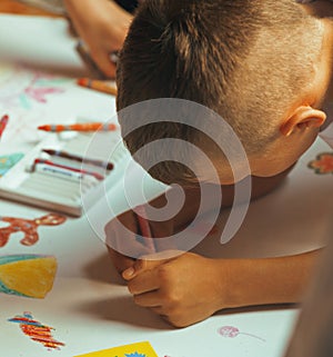 Little cute boy with company painting on birthday party