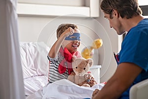 Little cute boy dressed like superhero with nurse