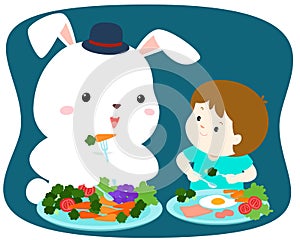 Little cute boy eating vegetable with white rabbit .