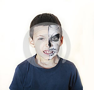 Little cute boy with face paint like skeleton to celebrate halloween, lifestyle people concept