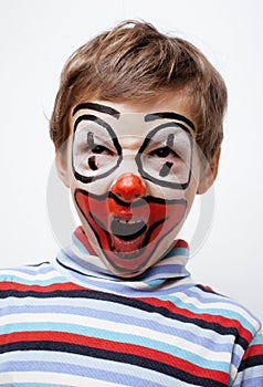 Little cute boy with facepaint like clown