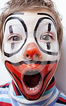 Little cute boy with facepaint like clown