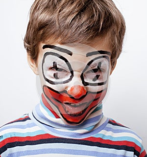 Little cute boy with facepaint like clown