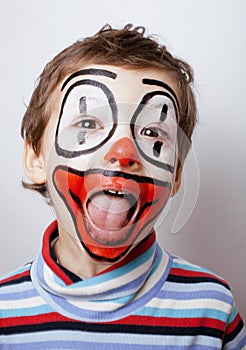 Little cute boy with facepaint like clown