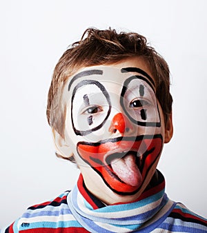 Little cute boy with facepaint like clown, pantomimic expression