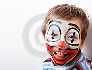 Little cute boy with facepaint like clown, pantomimic expressions close up
