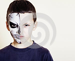 Little cute boy with facepaint like skeleton to celebrate hallow