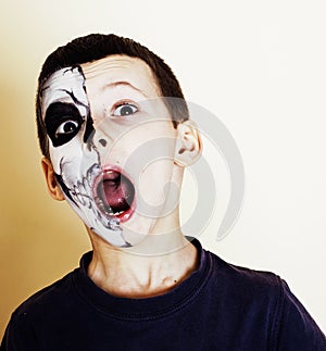 Little cute boy with facepaint like skeleton to celebrate hallow