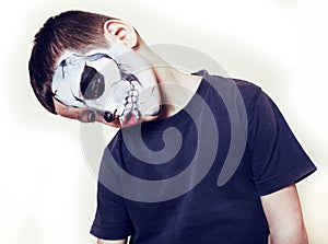 Little cute boy with facepaint like skeleton to celebrate halloween, lifestyle people concept, children on holiday