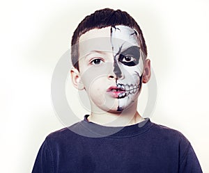 Little cute boy with facepaint like skeleton to celebrate halloween, lifestyle people concept, children on holiday