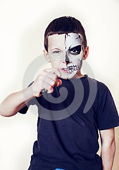 Little cute boy with facepaint like skeleton to celebrate halloween, lifestyle people concept, children on holiday