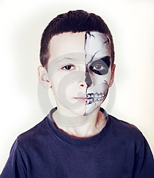 Little cute boy with facepaint like skeleton to celebrate halloween, lifestyle people concept, children on holiday