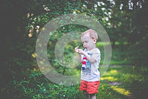 Boy playing in forest