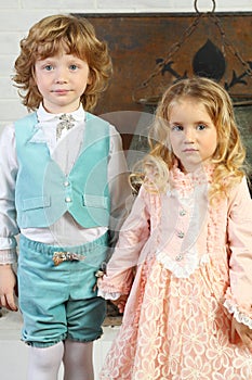 Little cute boy and girl in medieval costumes