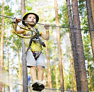 Little cute boy in helmet runs track