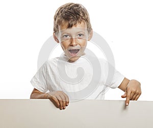 Little cute boy holding empty shit to copyspace