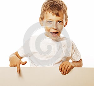 Little cute boy holding empty shit to copyspace