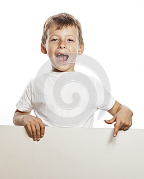 Little cute boy holding empty shit to copyspace