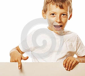 Little cute boy holding empty shit to copyspace