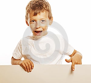 Little cute boy holding empty shit to copyspace