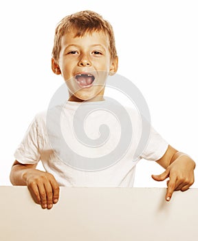 Little cute boy holding empty shit to copyspace