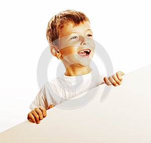 Little cute boy holding empty shit to copyspace close u