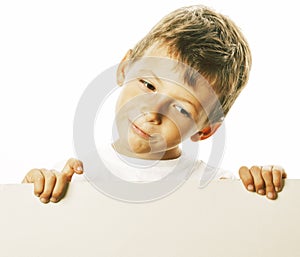 Little cute boy holding empty shit to copyspace  close up gesturing smiling