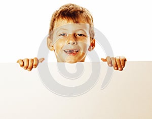 Little cute boy holding empty shit to copyspace isolated close u