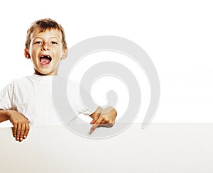 Little cute boy holding empty shit to copyspace isolated close u