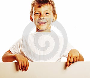 Little cute boy holding empty shit to copyspace isolated close up gesturing smiling