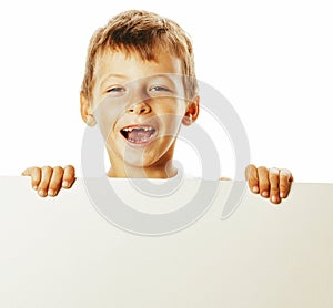 Little cute boy holding empty shit to copyspace isolated close up gesturing smiling