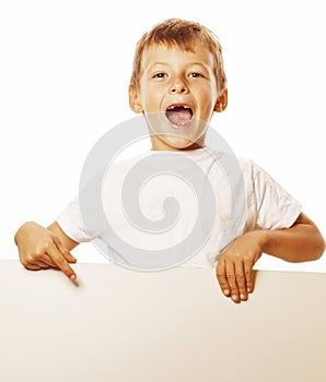 Little cute boy holding empty shit to copyspace isolated close up gesturing smiling