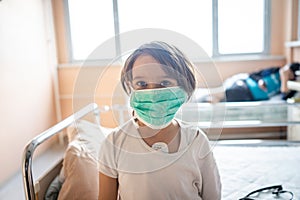 Little cute boy in hospital at bed