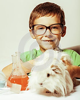 Little cute boy with medicine glass isolated wearing glasses smiling close up