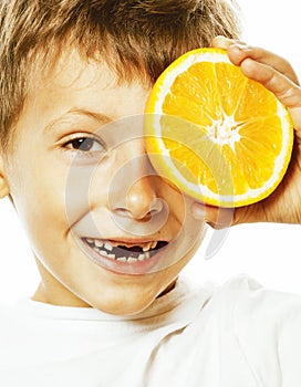 Little cute boy with orange fruit double isolated on white smiling without front teeth adorable kid cheerful