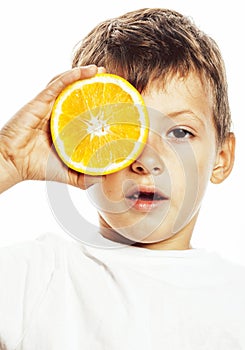 Little cute boy with orange fruit double isolated on white smiling without front teeth adorable kid cheerful