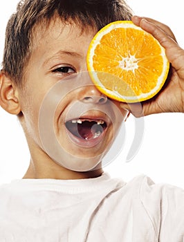 Little cute boy with orange fruit double isolated on white smiling without front teeth adorable kid cheerful