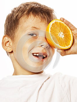 Little cute boy with orange fruit double isolated on white smiling without front teeth adorable kid cheerful