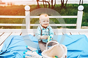 Little cute boy playing outdoor in the park